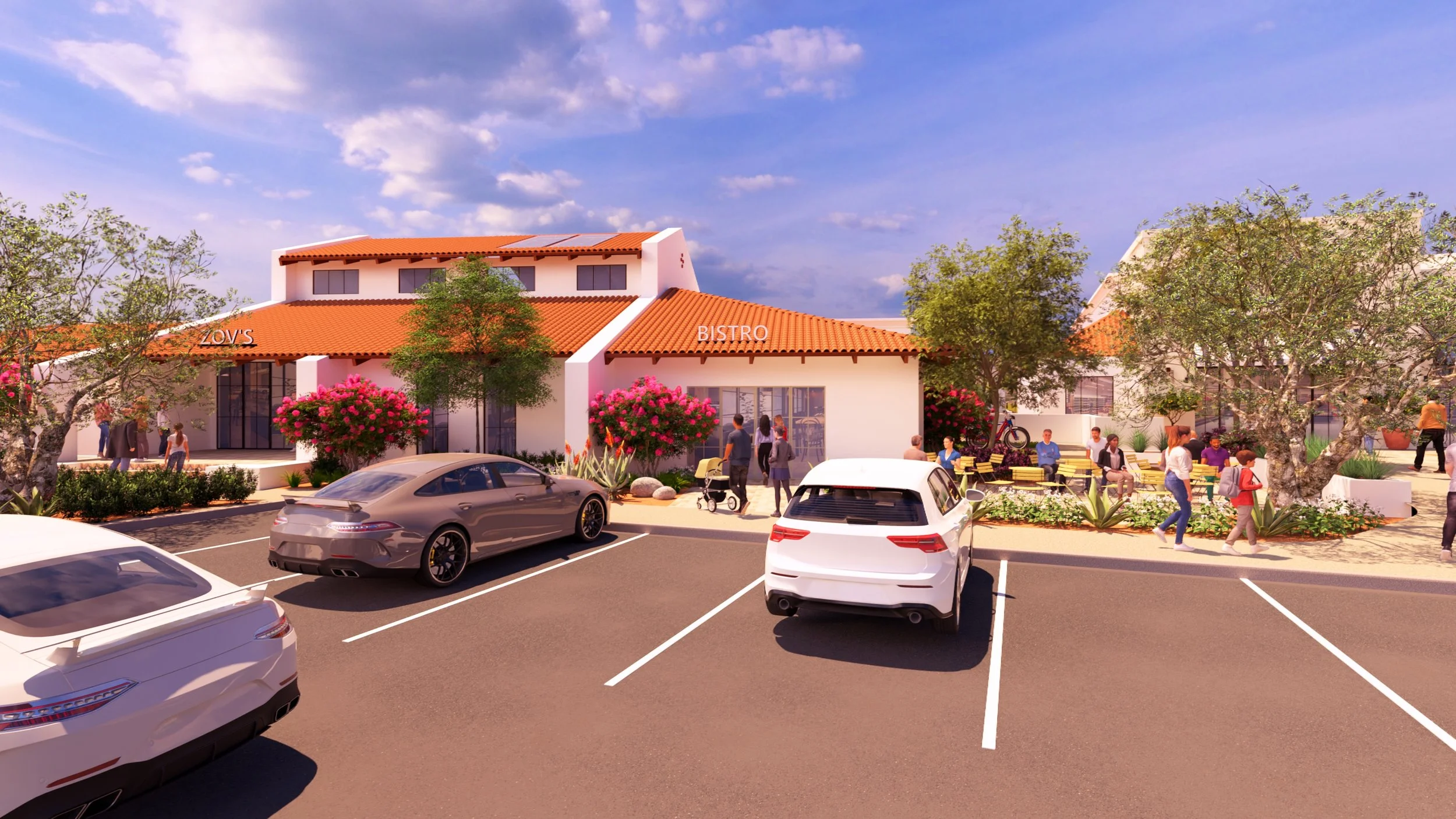 A lively community scene outside a building with a red tile roof, with people walking, sitting, and socializing, and cars parked in a lot.