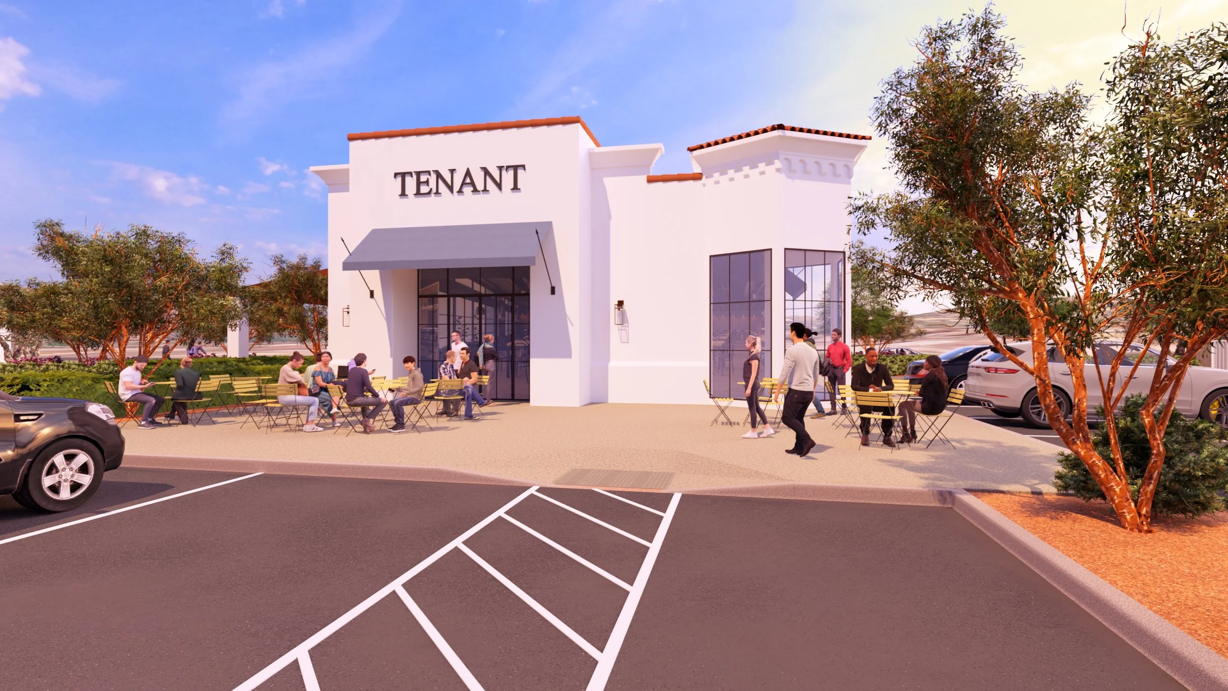 A modern small building with a sign that reads 'TENANT' on top, featuring large glass windows and an outdoor seating area. People are sitting at yellow tables and chairs, with some walking or talking outside. There are trees and parked cars in the ba