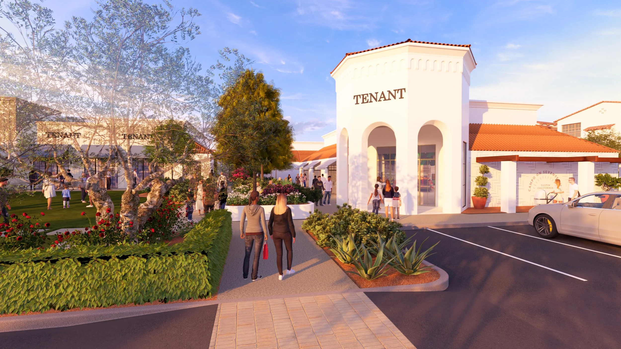 A shopping center with pedestrians walking nearby, surrounded by greenery and flowering plants. The building has a white exterior with red-tiled roofs and the word 'TENANT' displayed on the front. There is a parking lot with a car parked near the ent