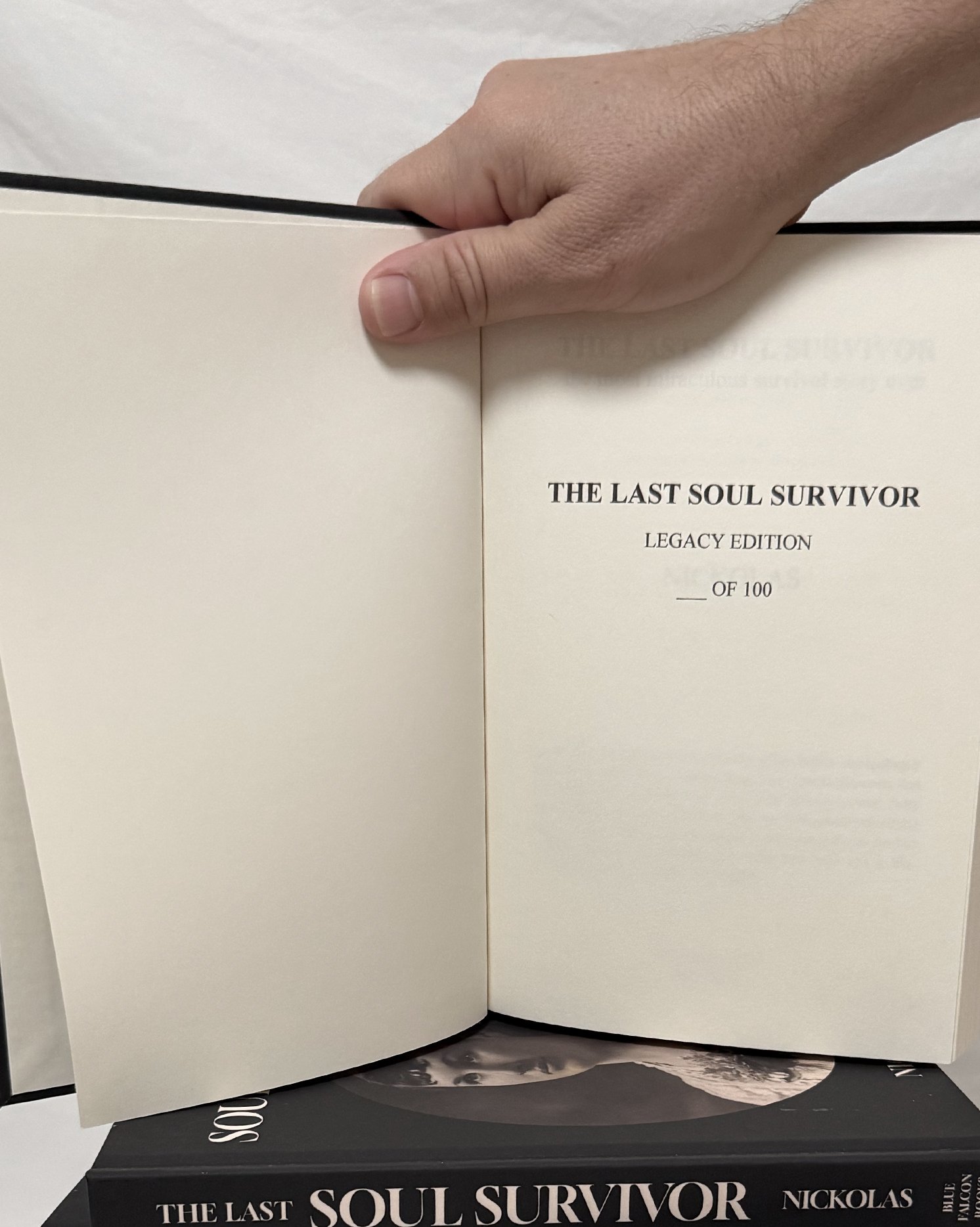 Open book displaying page with the title 'The Last Soul Survivor' by Nickolas.