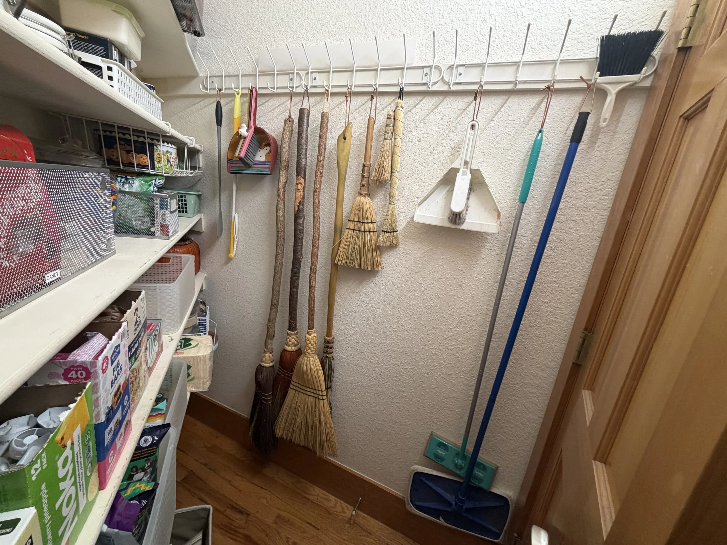 AFTER…Not only can the door open fully, it can close fully, keeping the business end of the home hidden from the party side. Cleaning tools are neatly organized and segregated from the food and dry goods and, most importantly, easily accessible.