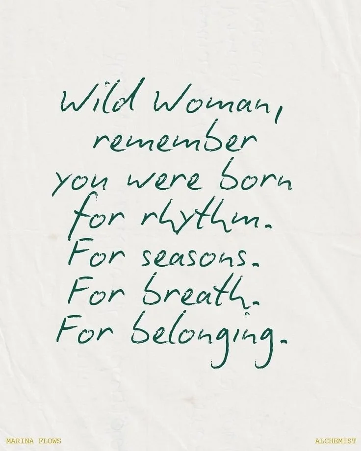 Handwritten quote on white paper that reads: "Wild Woman, remember you were born for rhythm. For seasons. For breath. For belonging."