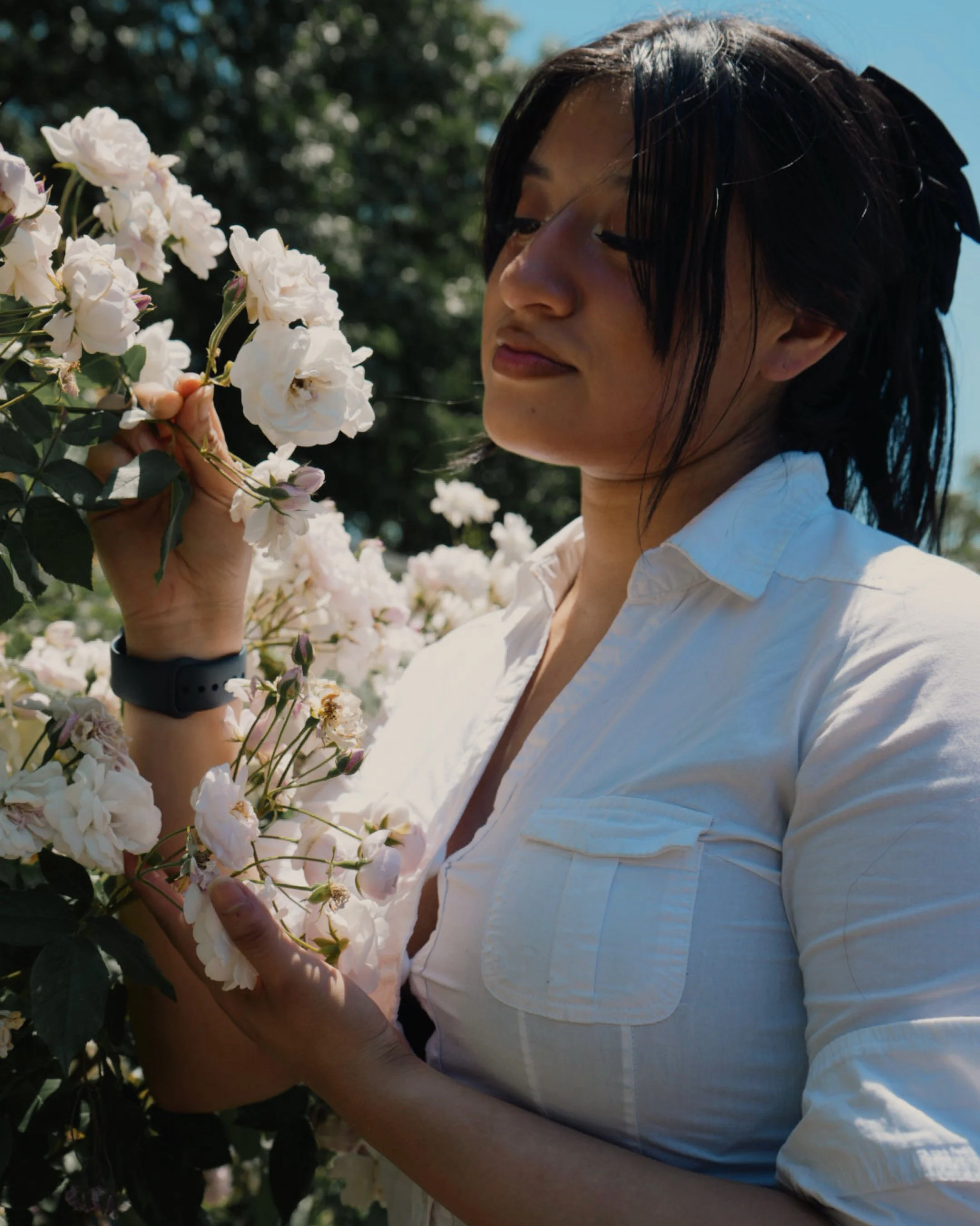 A portrait photo of Maria Cortez, shot by Marc Andrew DeJesus who offers portrait photography to anyone looking to capture their presence and personality through documentation. Most of Marc's portraits are captured at Brooklyn Botanic Garden.