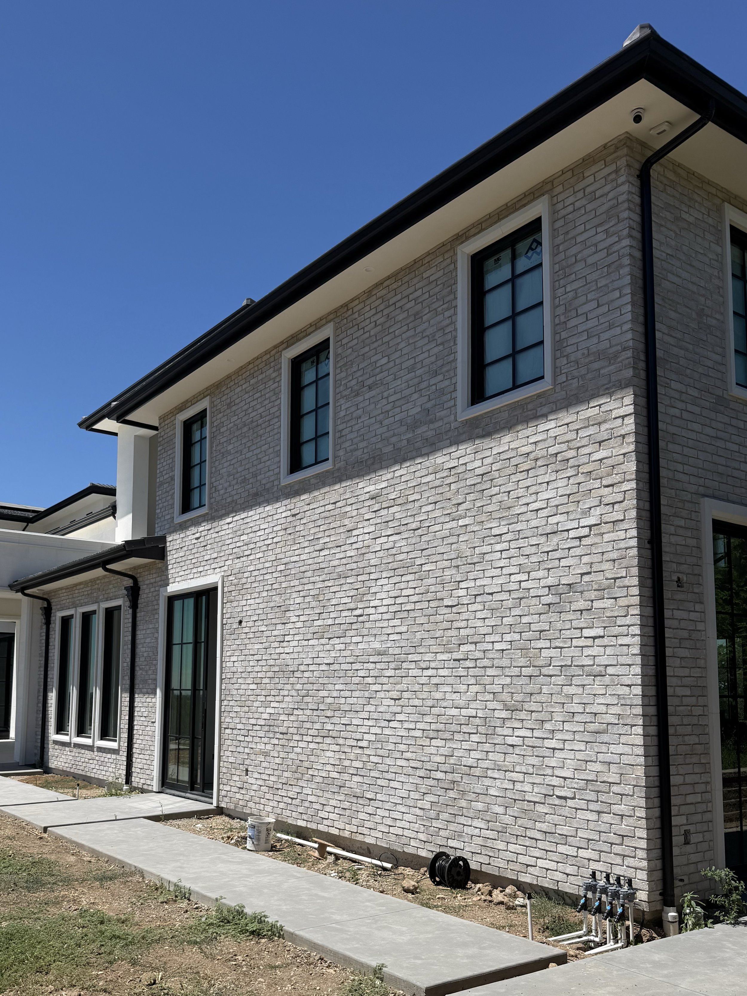 Gutter Installation of 6" black k-style gutter at this beautiful Granite Bay home