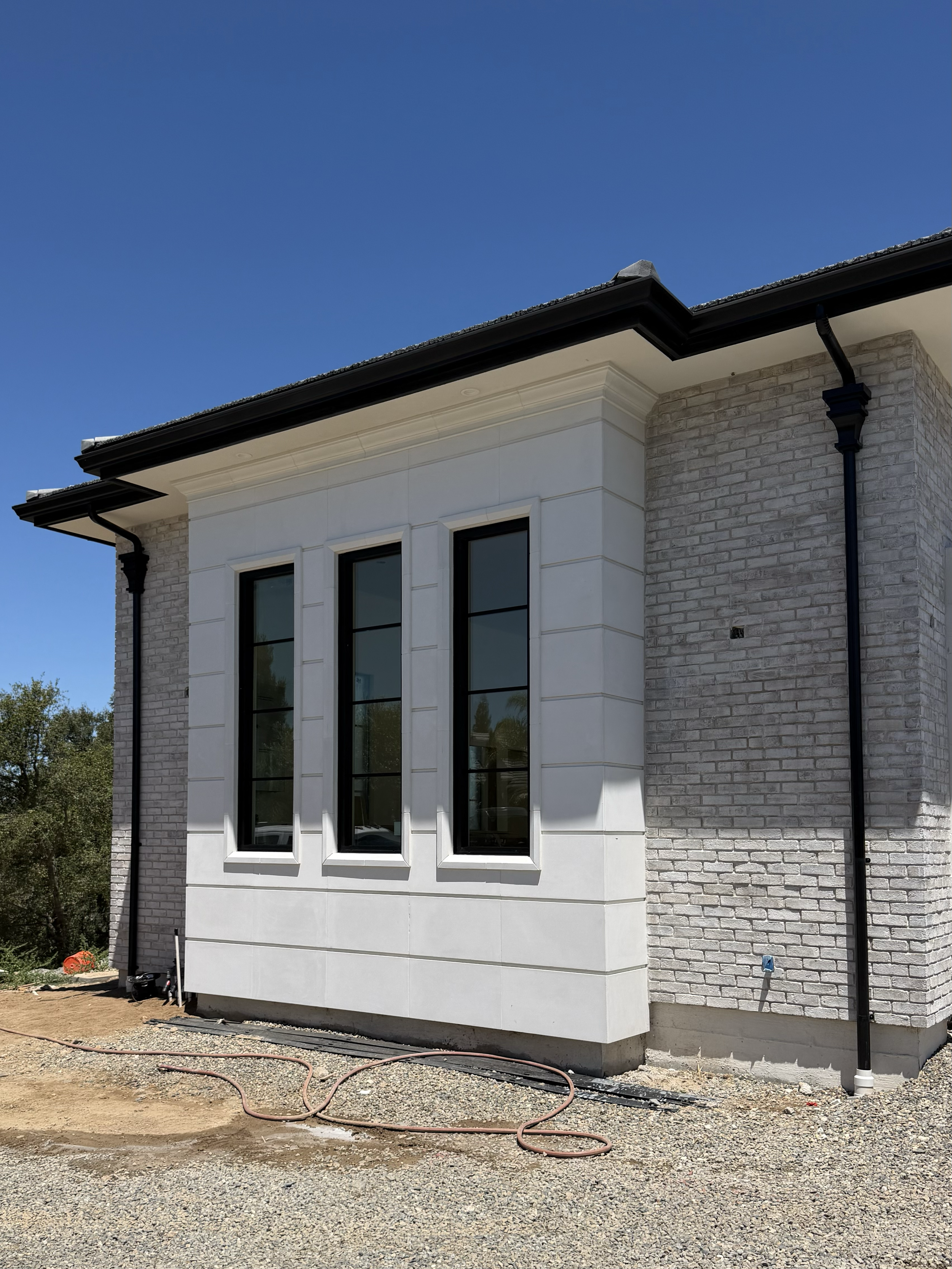 Gutter Installation of 6" black k-style gutter at this beautiful Granite Bay home