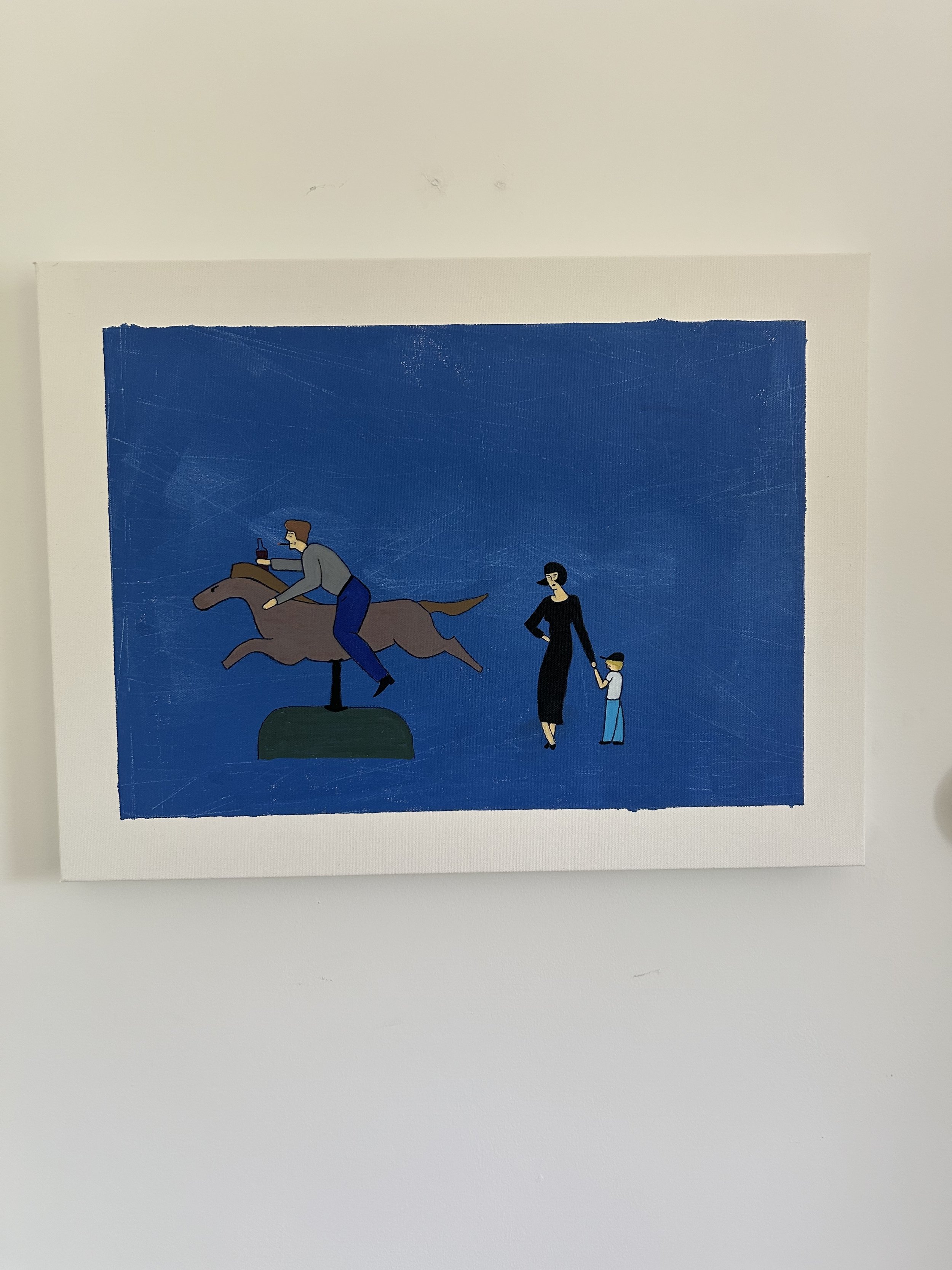 A drunken man occupies a mechanical horse ride intended for a child while a mother and son anxiously wait.