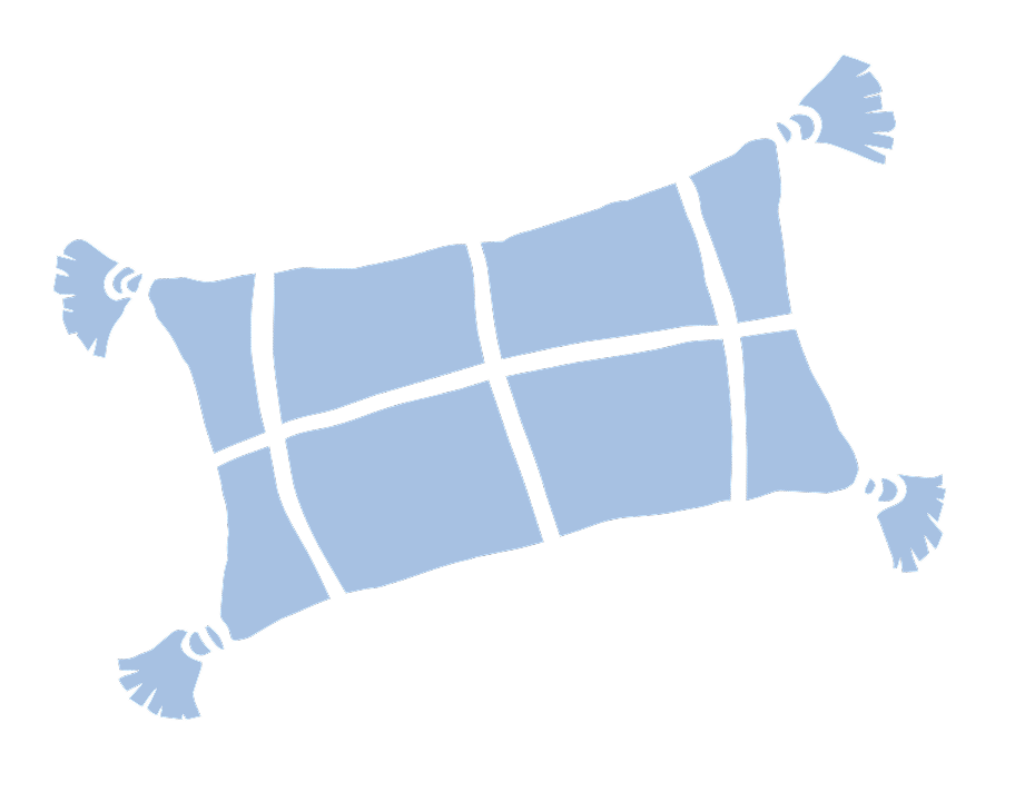 A blue checkered pillow with tassels on each corner, viewed from above.