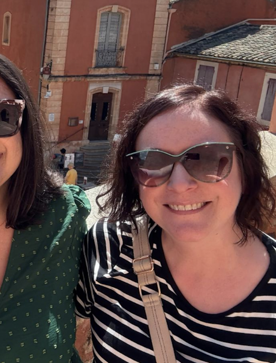 A guest smiles in the sunshine while vacationing in France with all female travel company Maison d'Amies.