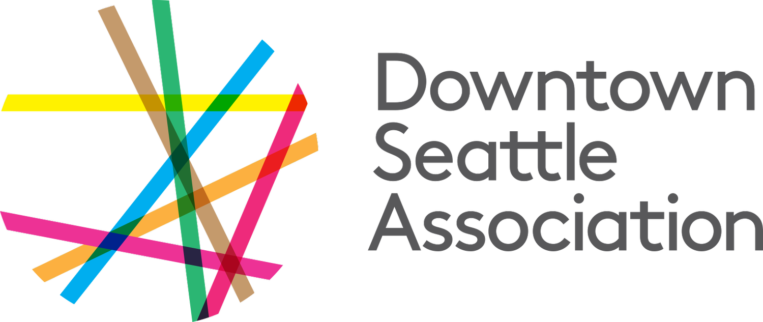 Logo of the Downtown Seattle Association with colorful abstract lines on a black background.