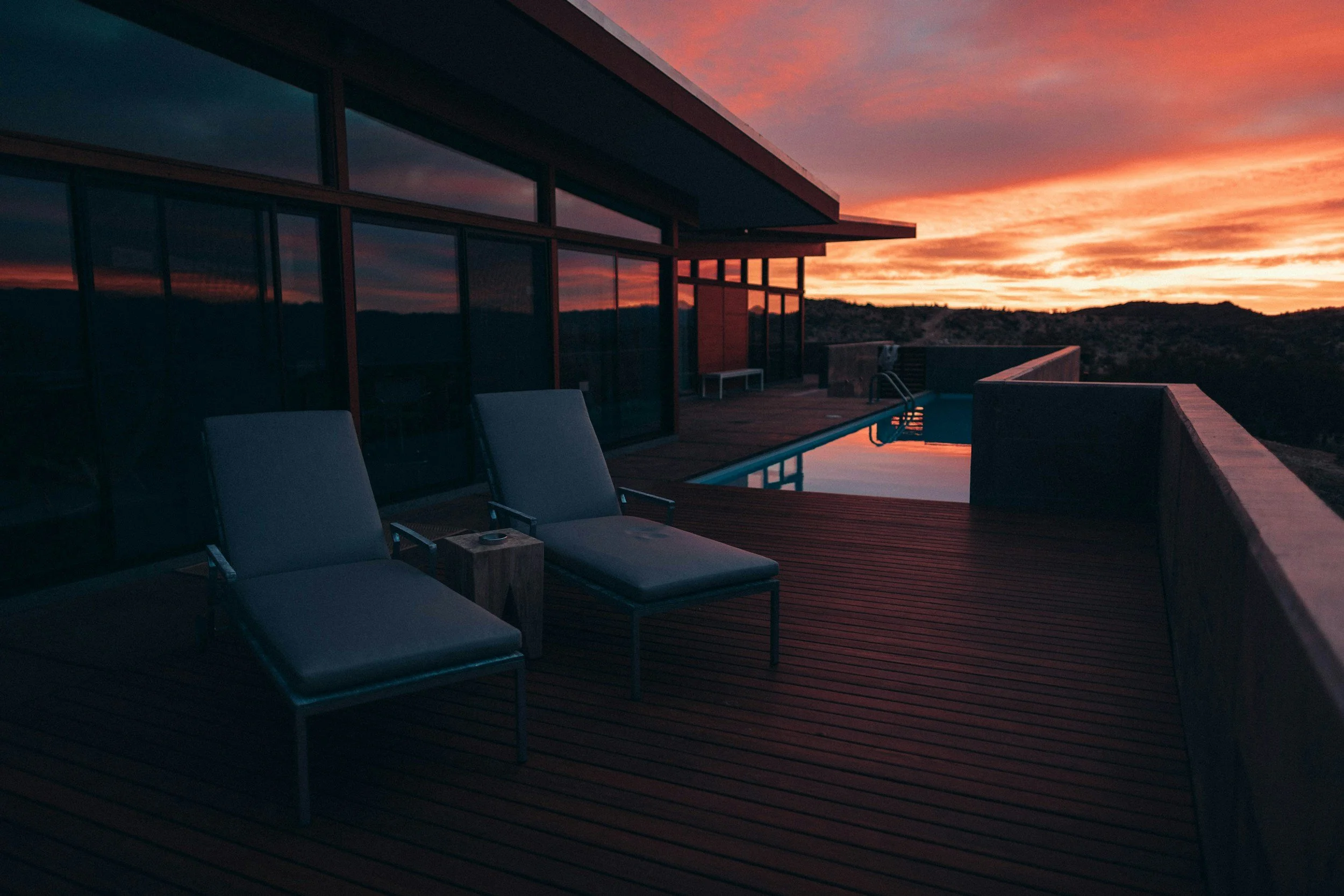 modern home pool at sunset