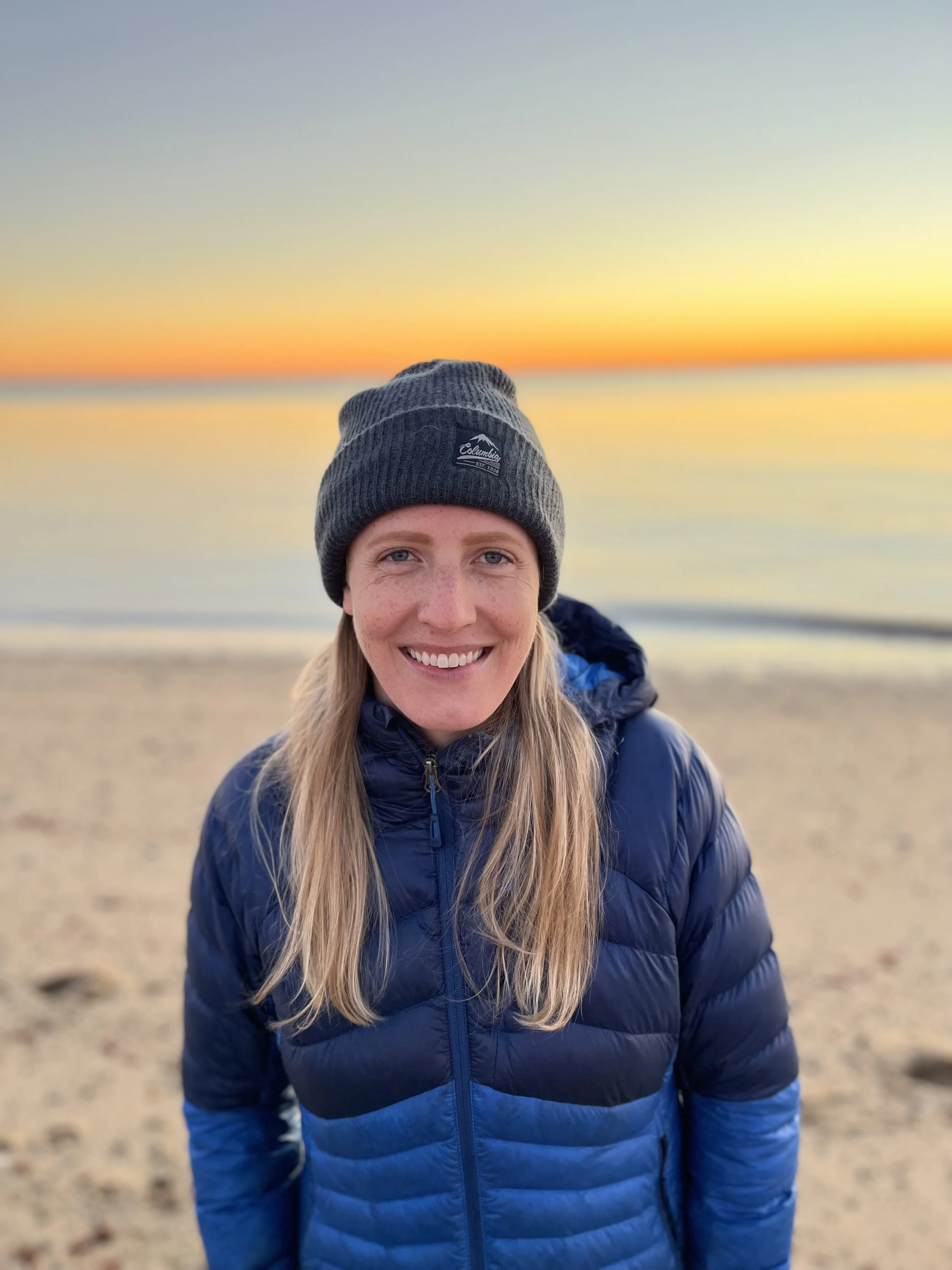 Portrait of Beth Maguire with sunset in the background