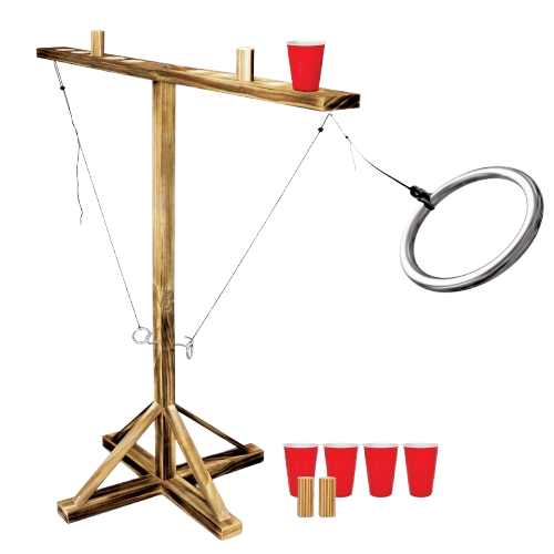 A cornhole game setup with a wooden board, four red cups, a ring toss game, and a red cup on top of the board.