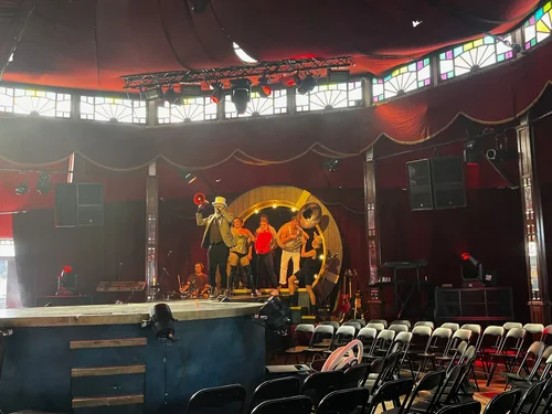 Live circus performance with audio system visible
