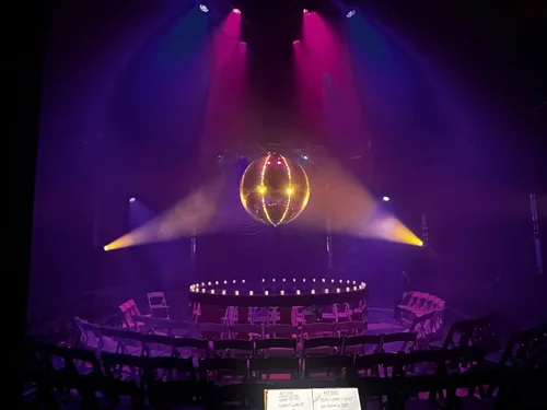 Theatrical performance space lit in purple