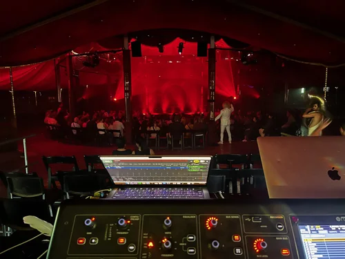Front-of-house console overlooking an outdoor festival stage