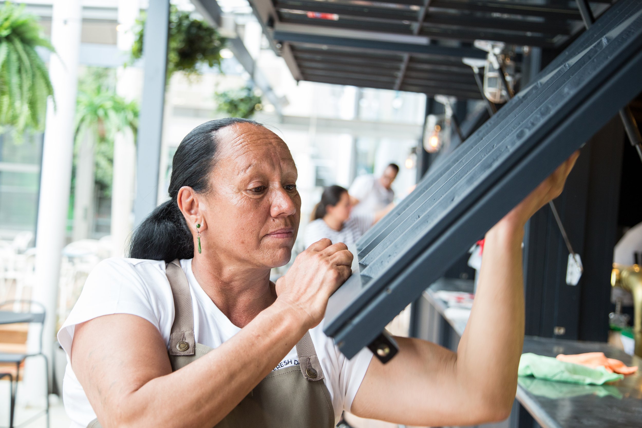 Tangimoe Clay cleaning a window at AFM.jpg
