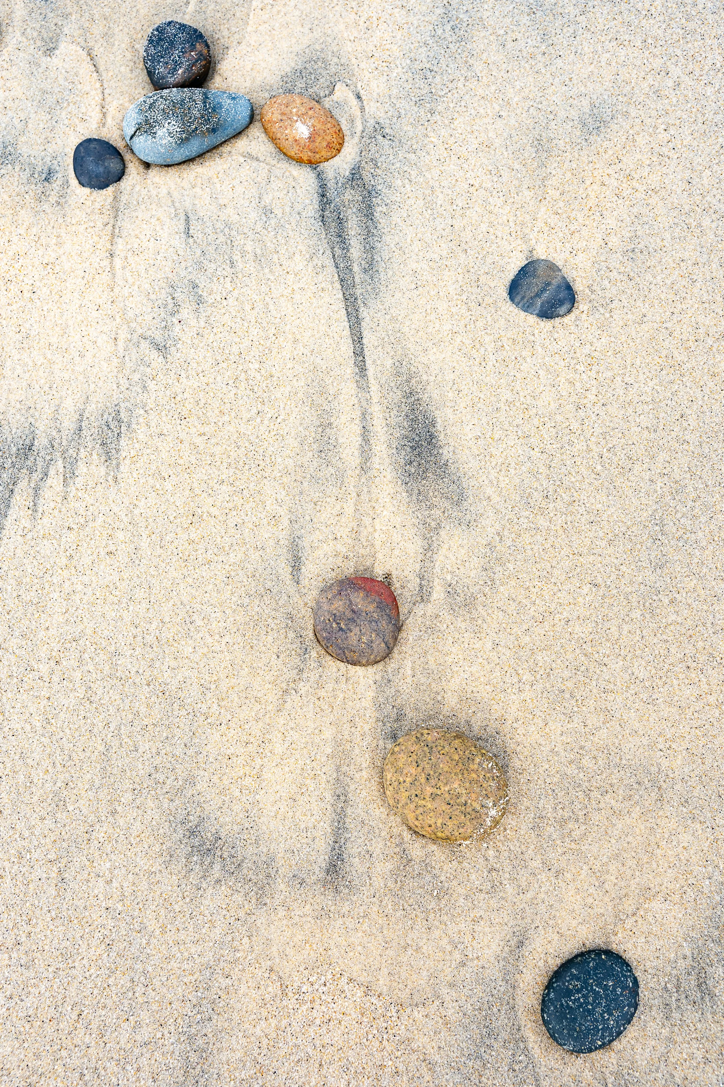 photo of rocks in beach  sand