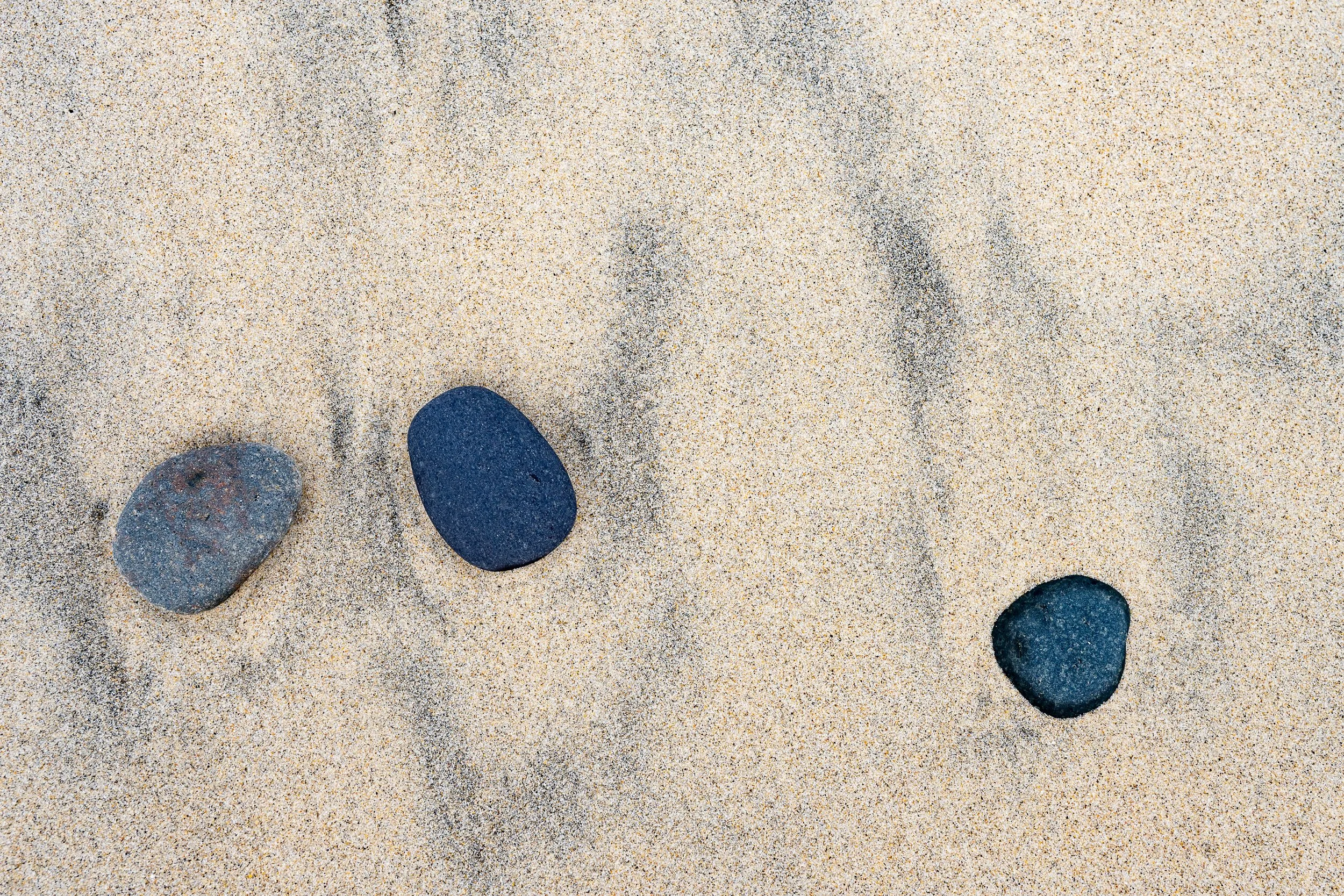 photo of rocks in beach  sand