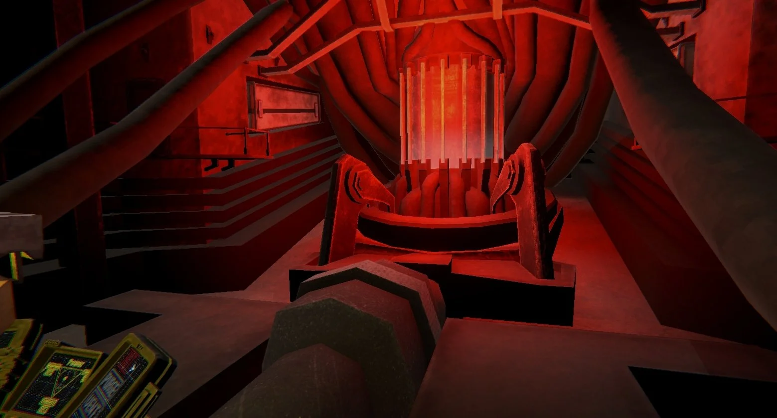 Futuristic, red-lit interior with a central cylindrical glowing structure surrounded by metallic supports, pipes, and machinery.