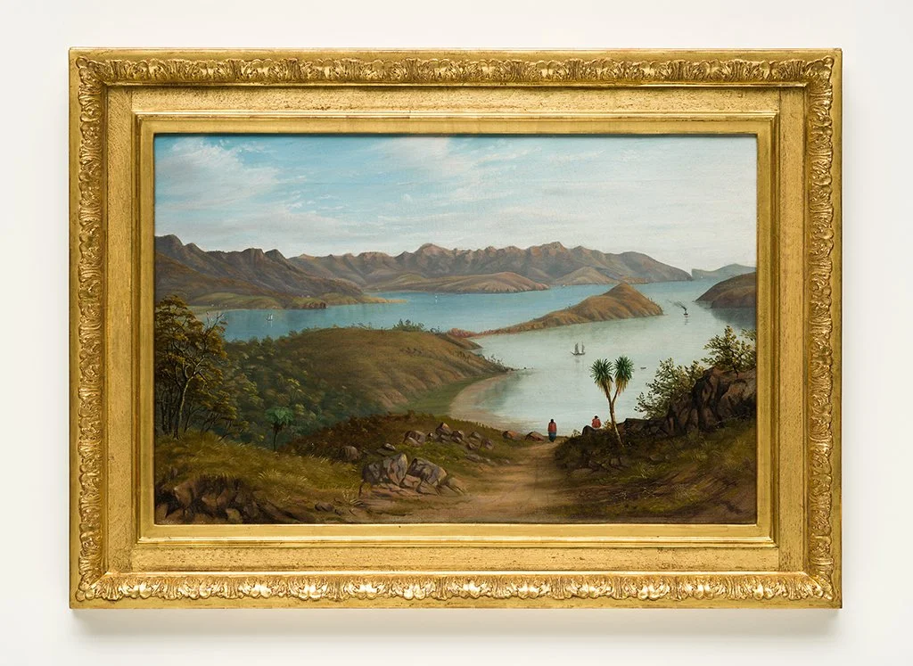 Landscape painting of a lake with mountains in the background, trees in the foreground, and people and sailboats on the water. Akaroa Museum Collection