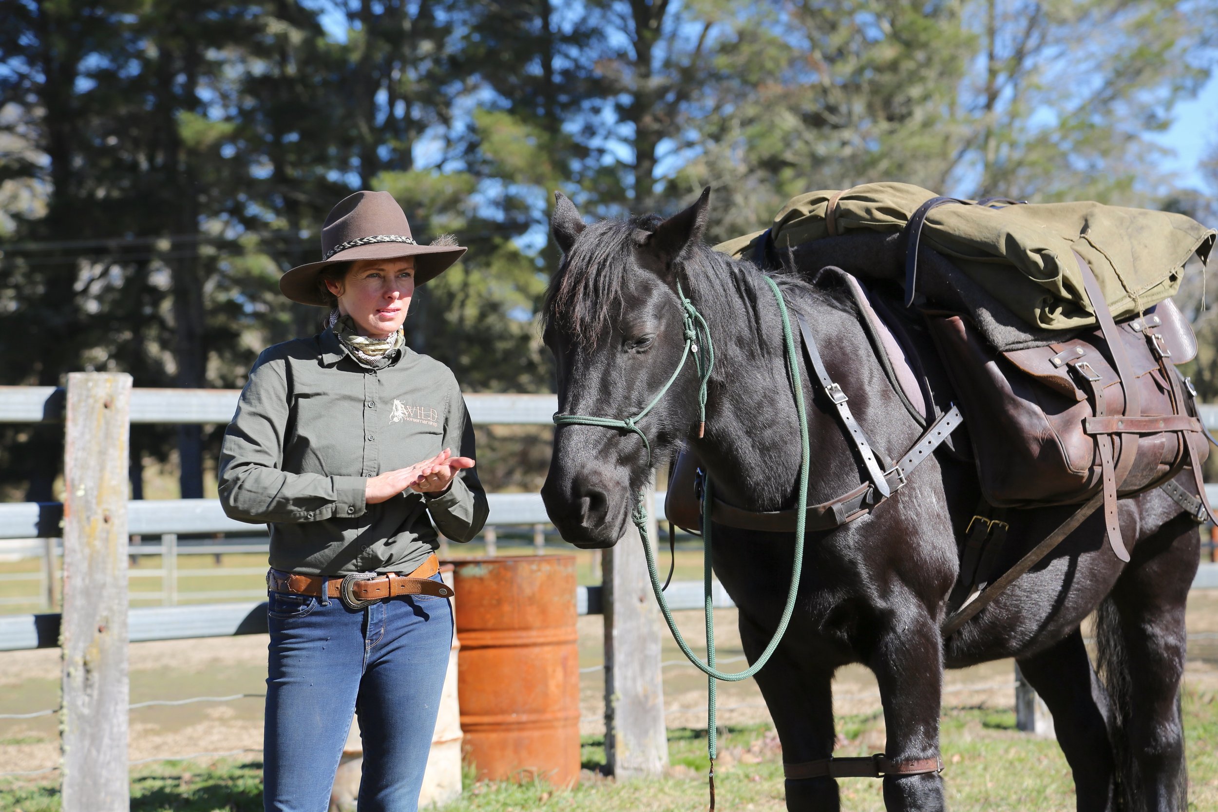 Kate Young with pack saddling horse