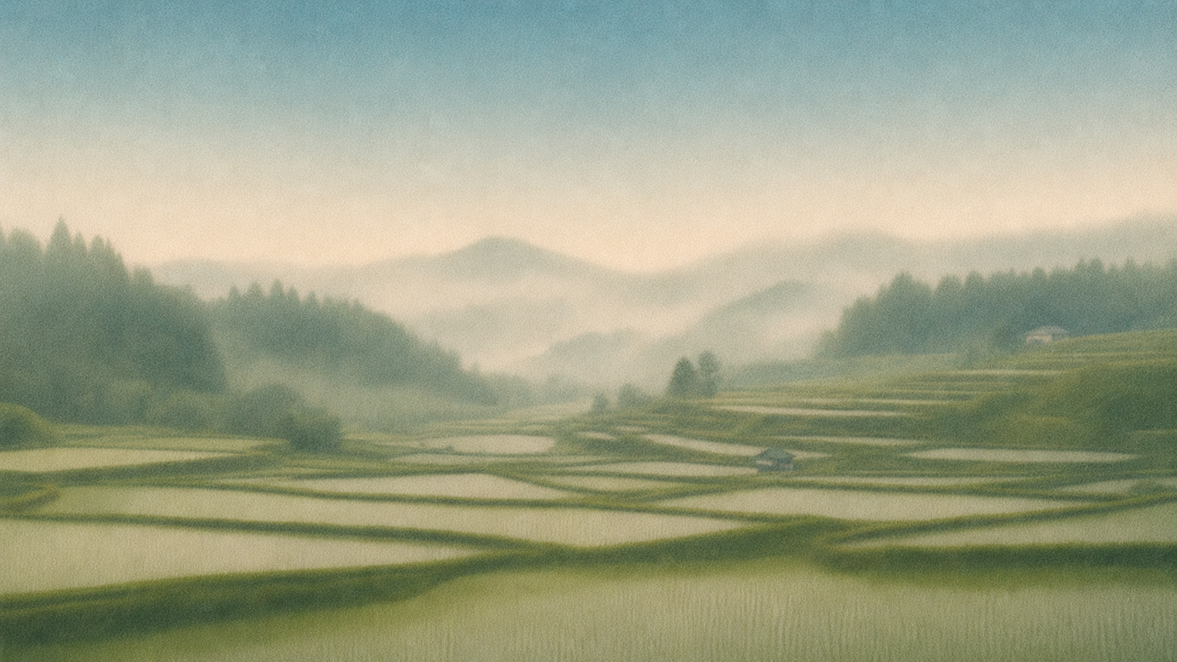 A hazy landscape of terraced rice fields on rolling hills with mountains in the background and faint mist in the air.
