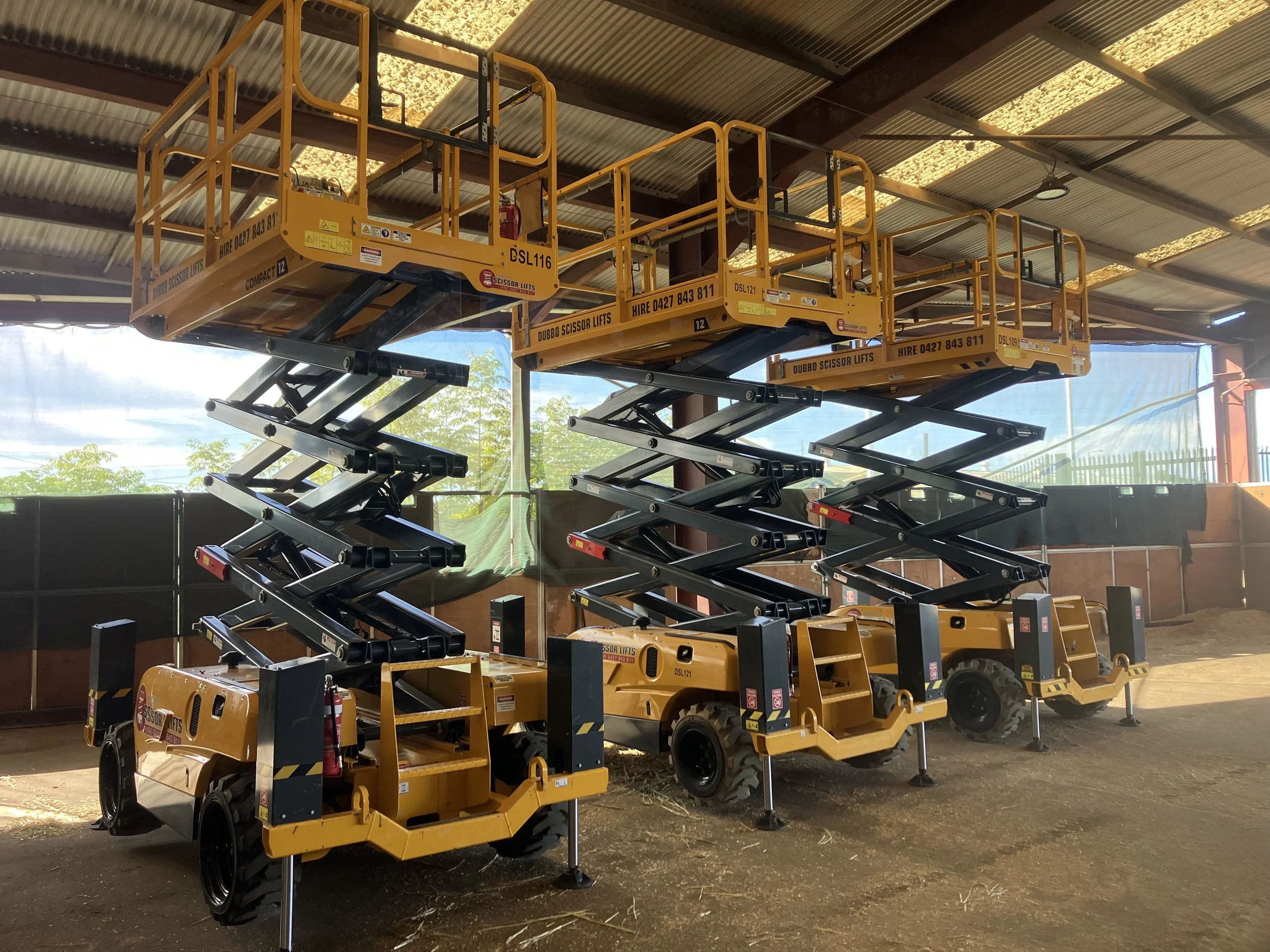 3 partially extended 10DX scissor lifts
