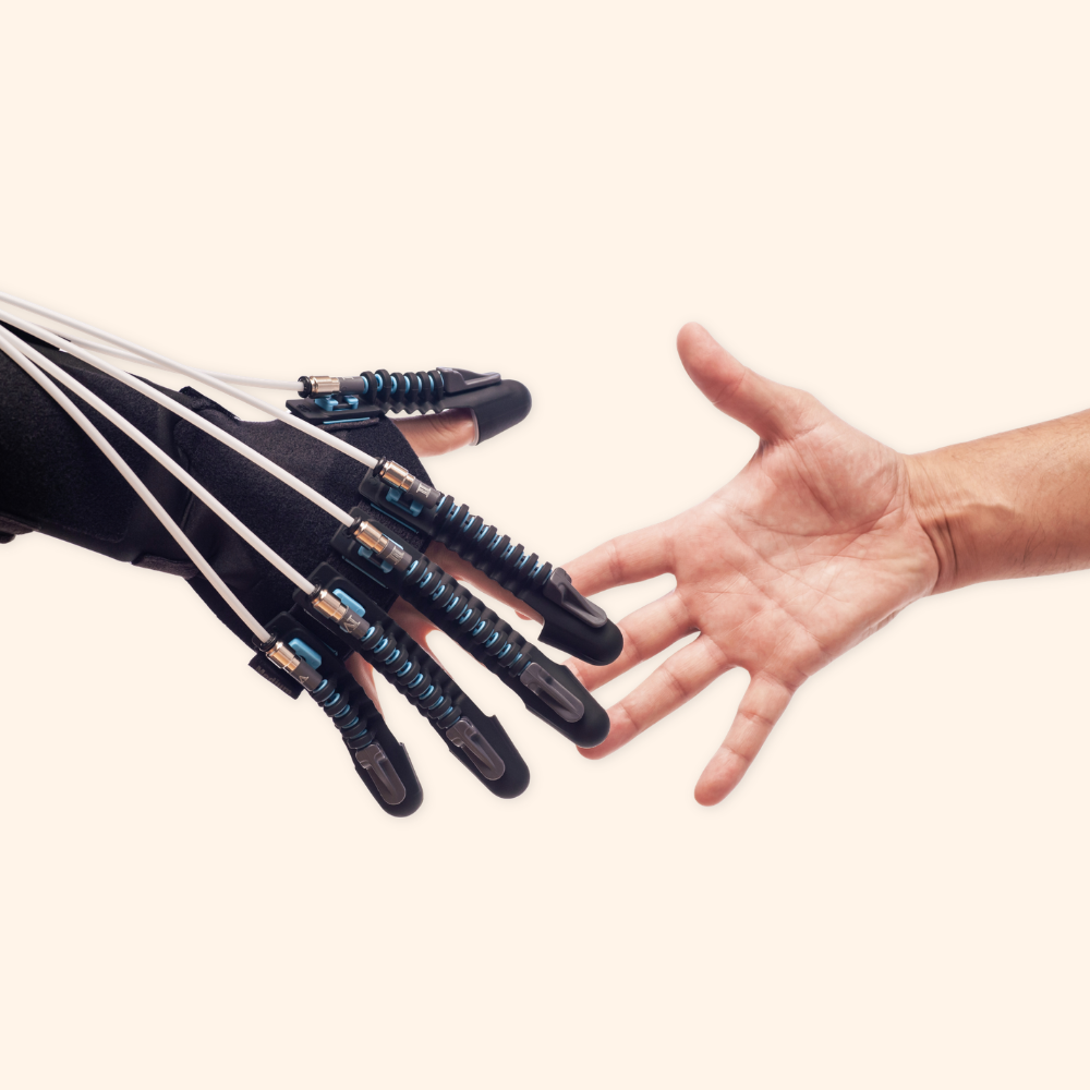 A human hand reaching out to shake hands with a robotic prosthetic hand.