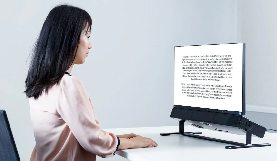 Research participant using the Tobii Pro Spectrum eye tracker for reading behavior, eye movement, and literacy research