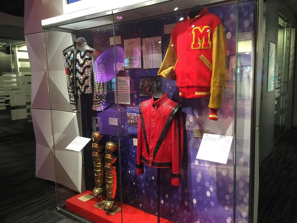 Artifact displays integrate into each exhibit area.