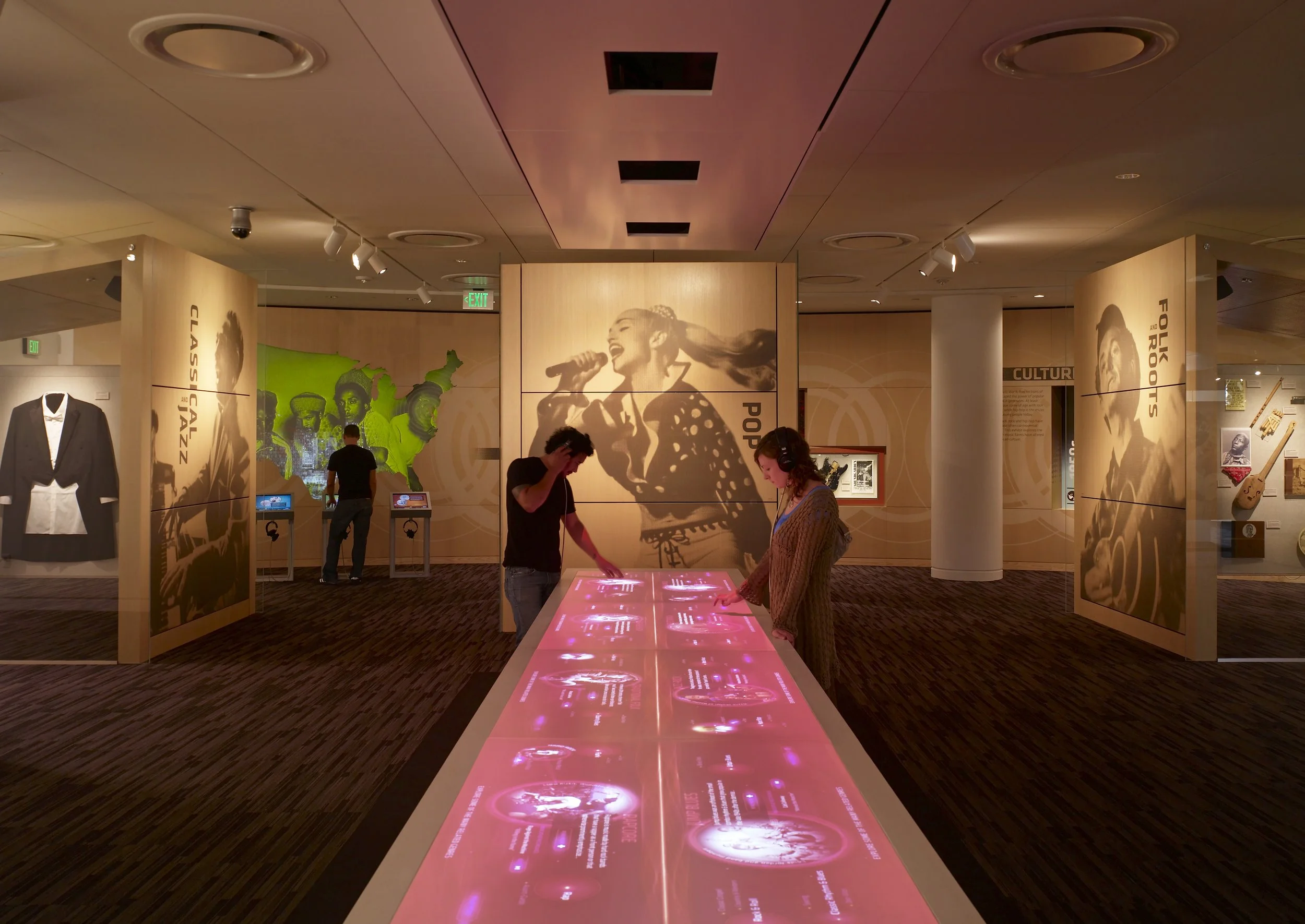 Visitors explore the diversity and interconnectivity of music at the Genre Table.
