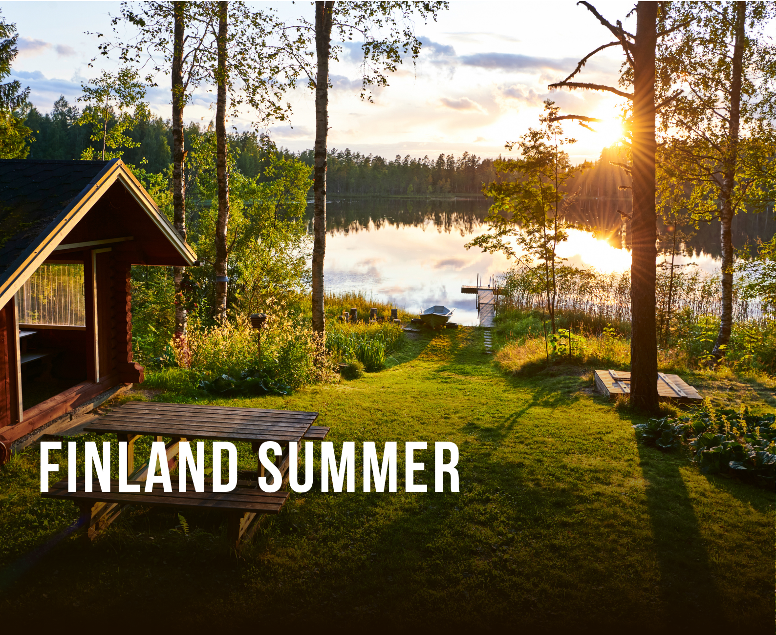 Sunset over a calm lake surrounded by trees, with a small wooden dock and boat, and a garden with a cabin and lush greenery in Finland during summer.