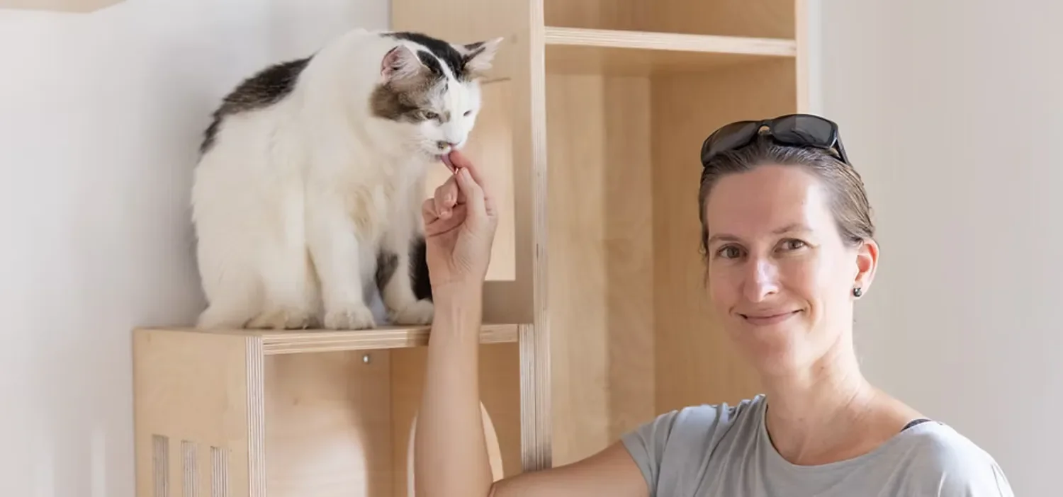 Kerstin caring for a cat at Shangri-Paw Singapore