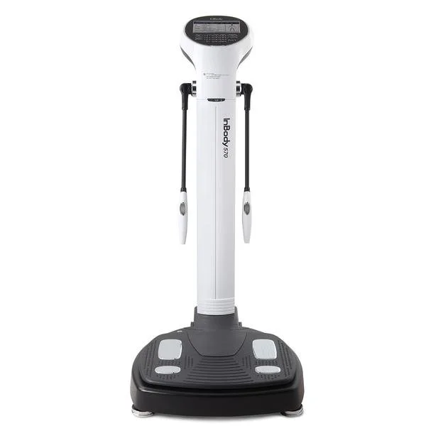 A white and black medical or fitness device with a vertical column, handles with attached sensors, and a sturdy base, labeled 'hBody 570'.