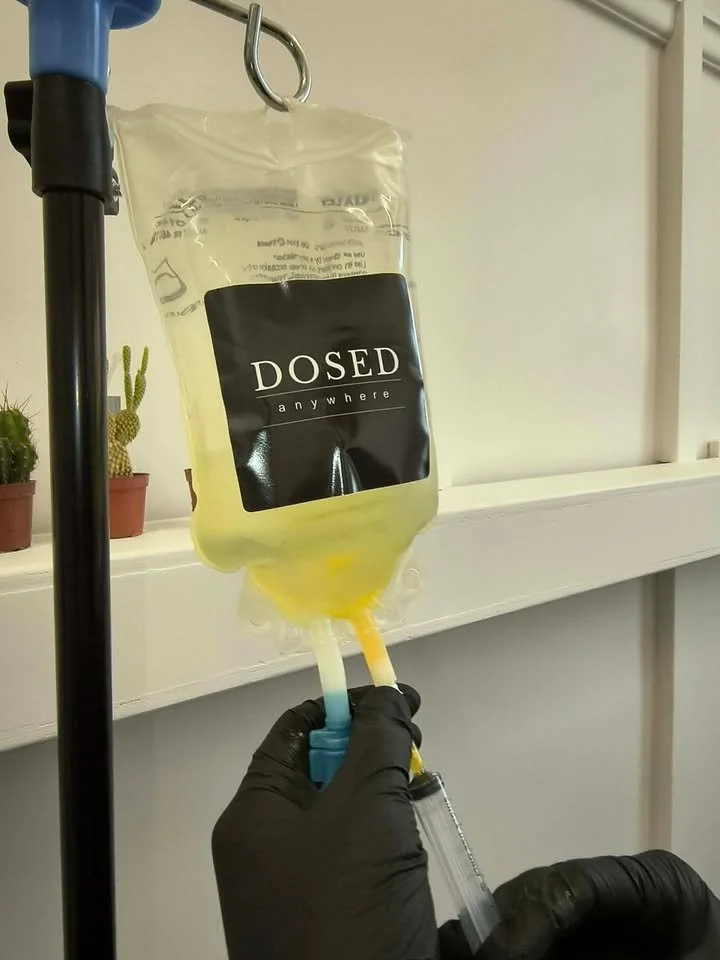 Nurse preparing a personalised IV wellness infusion for a client at Dosed Anywhere in Hawke's Bay.