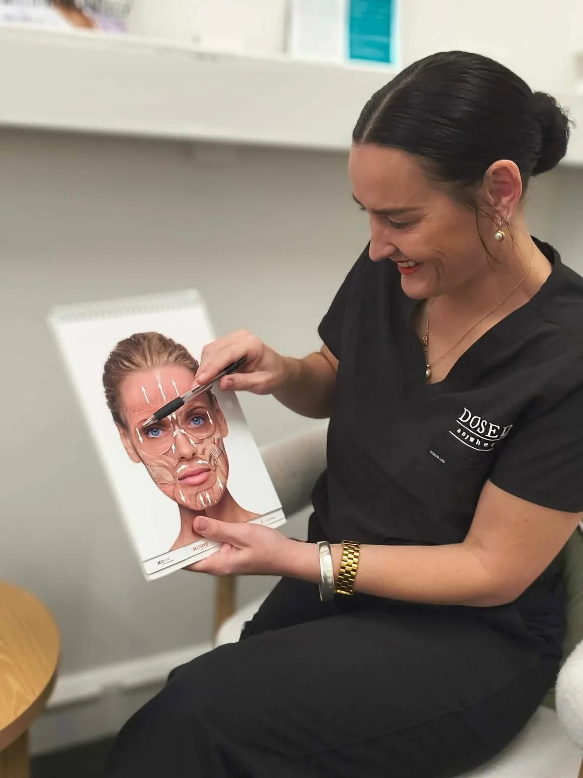 Olivia, Registered Nurse at Dosed Anywhere, explaining facial anatomy during a personalised cosmetic injectable consultation in Hawke's Bay.
