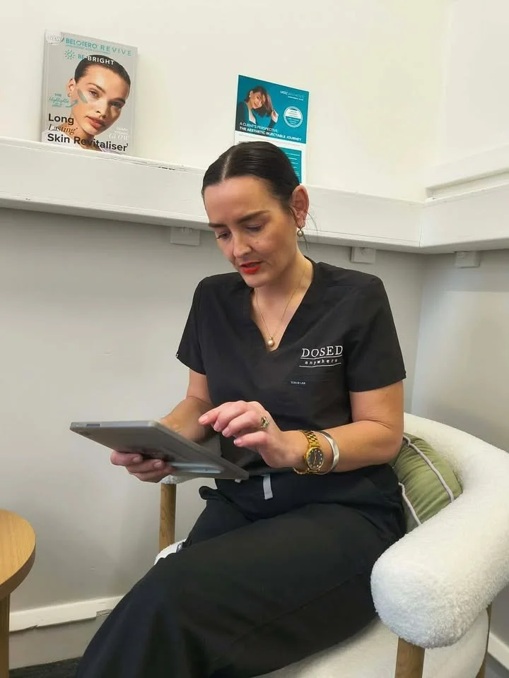 Qualified cosmetic injector and IV therapy practitioner discussing a personalised treatment plan.
