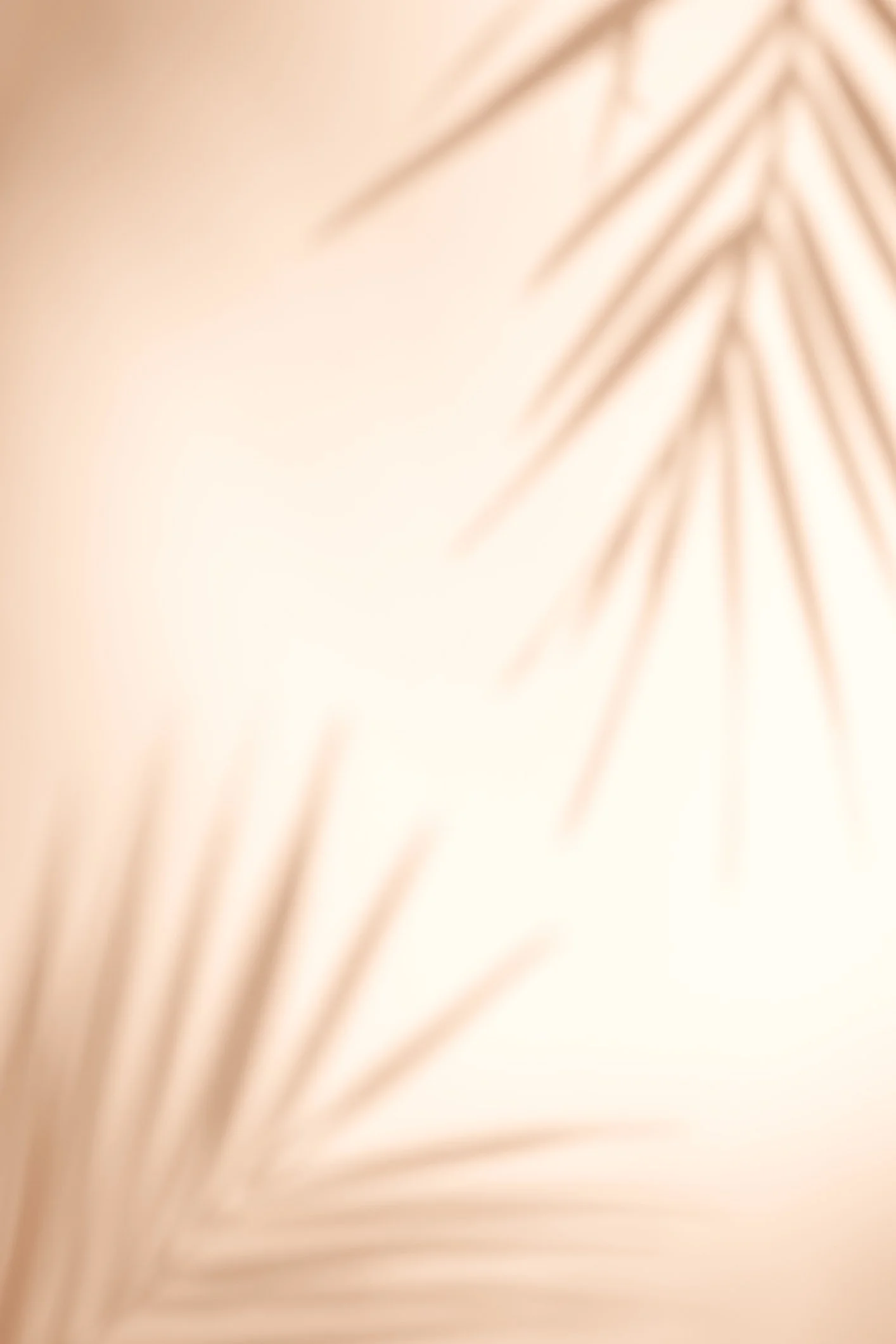 Close-up of beige textured fabric with soft shadows.