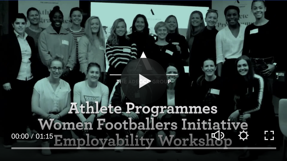 Group of women and men posing in a room, participating in the Athlete Programmes Women Footballers Initiative Employability Workshop