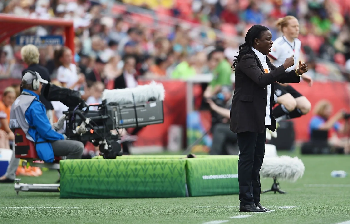 Women coach in the stadium