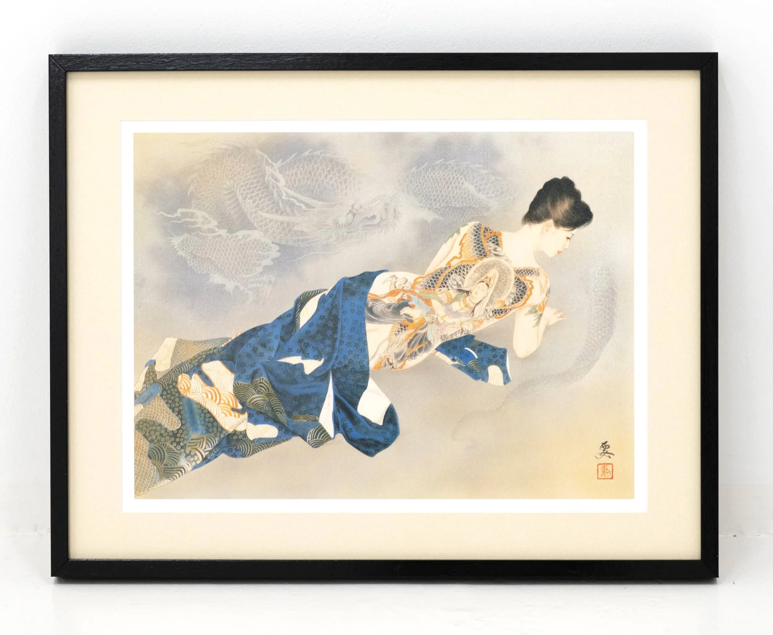 Framed Japanese artwork featuring a woman in traditional kimono with detailed patterns, signature stamps, and a dragon background.
