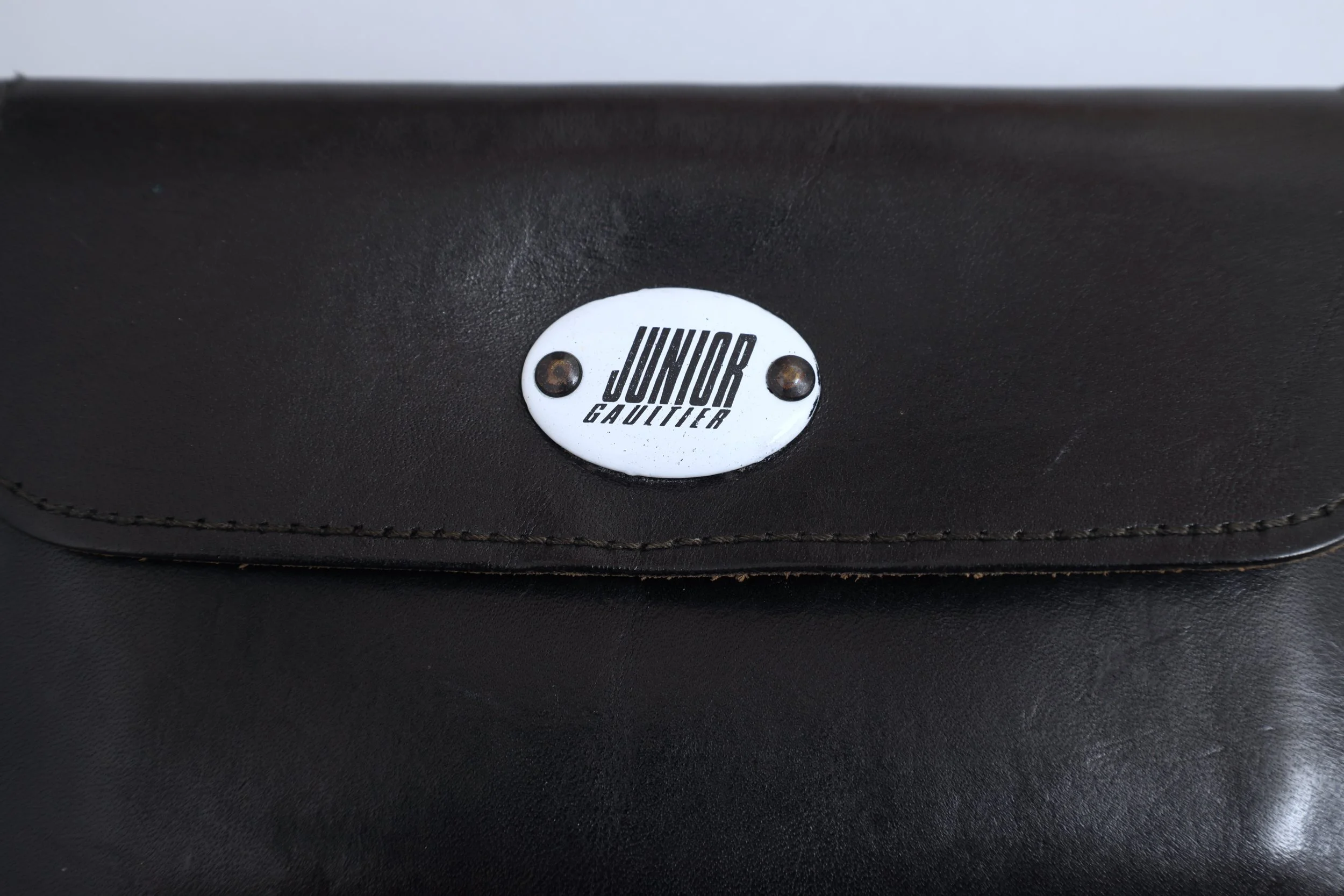 1980s Junior Gaultier enamel logo tag