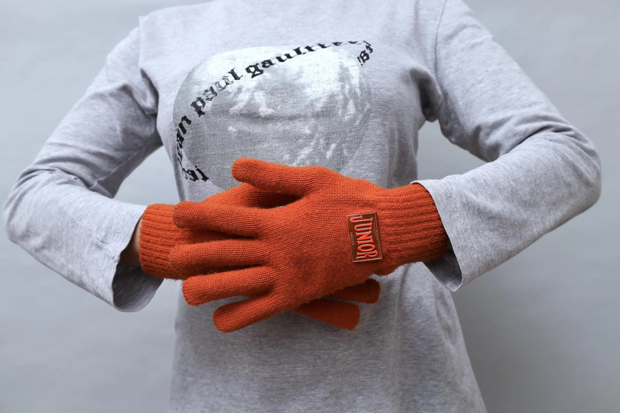 early 1990s Junior Gaultier rubber tag burnt orange knit gloves