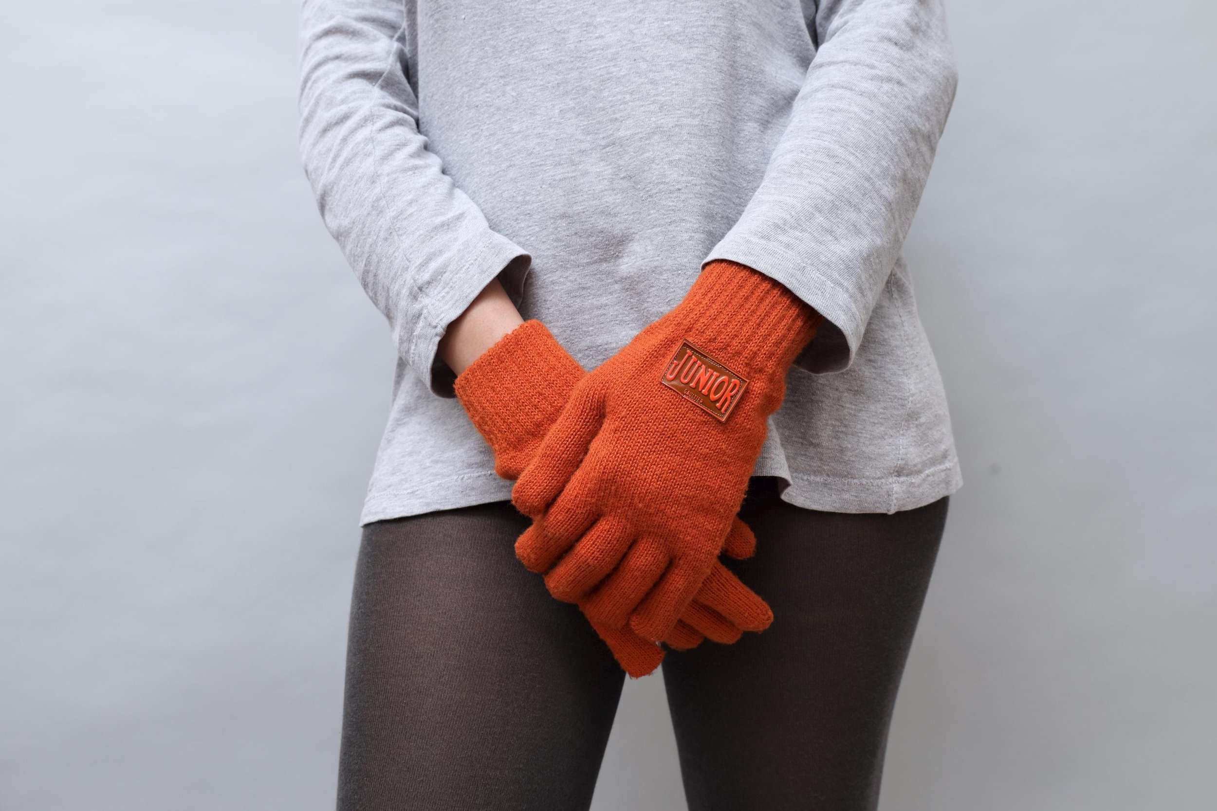 early 1990s Junior Gaultier rubber tag burnt orange knit gloves