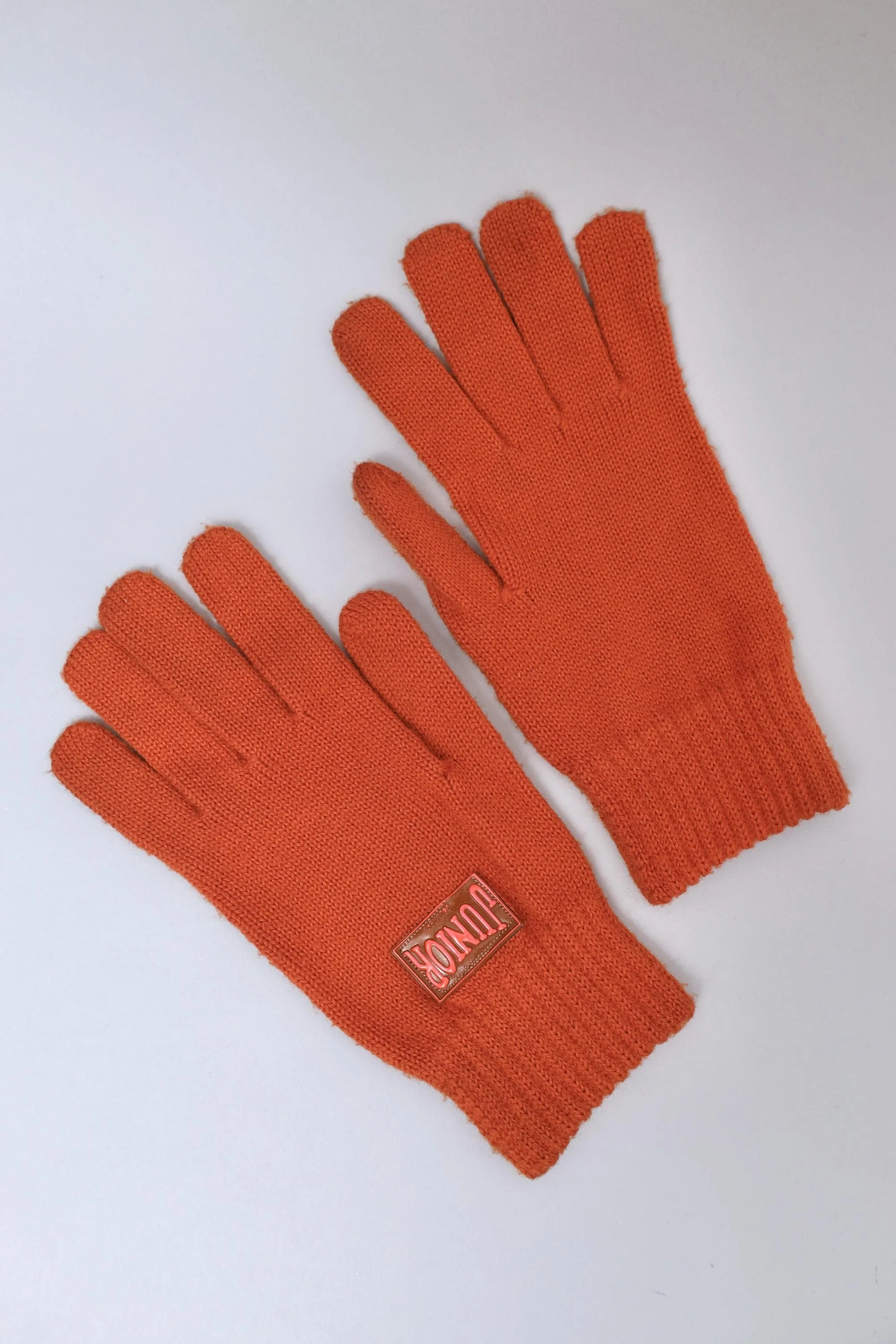 early 1990s Junior Gaultier rubber tag burnt orange knit gloves