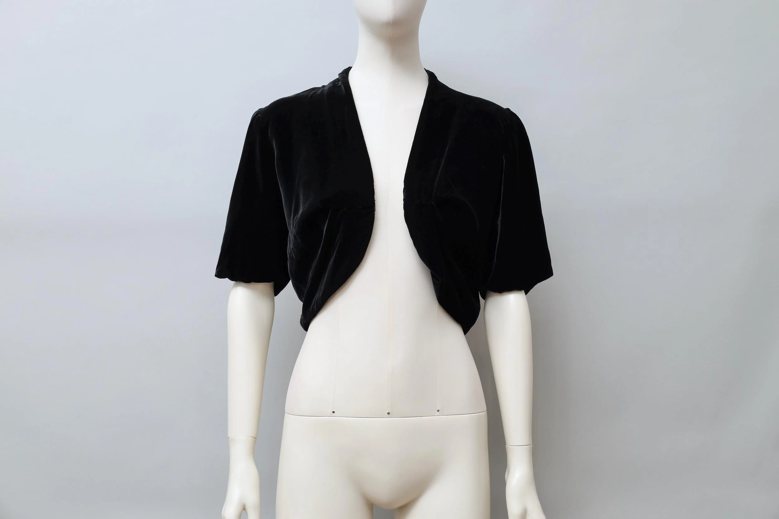 1980s Norma Kamali black rayon velvet shrug