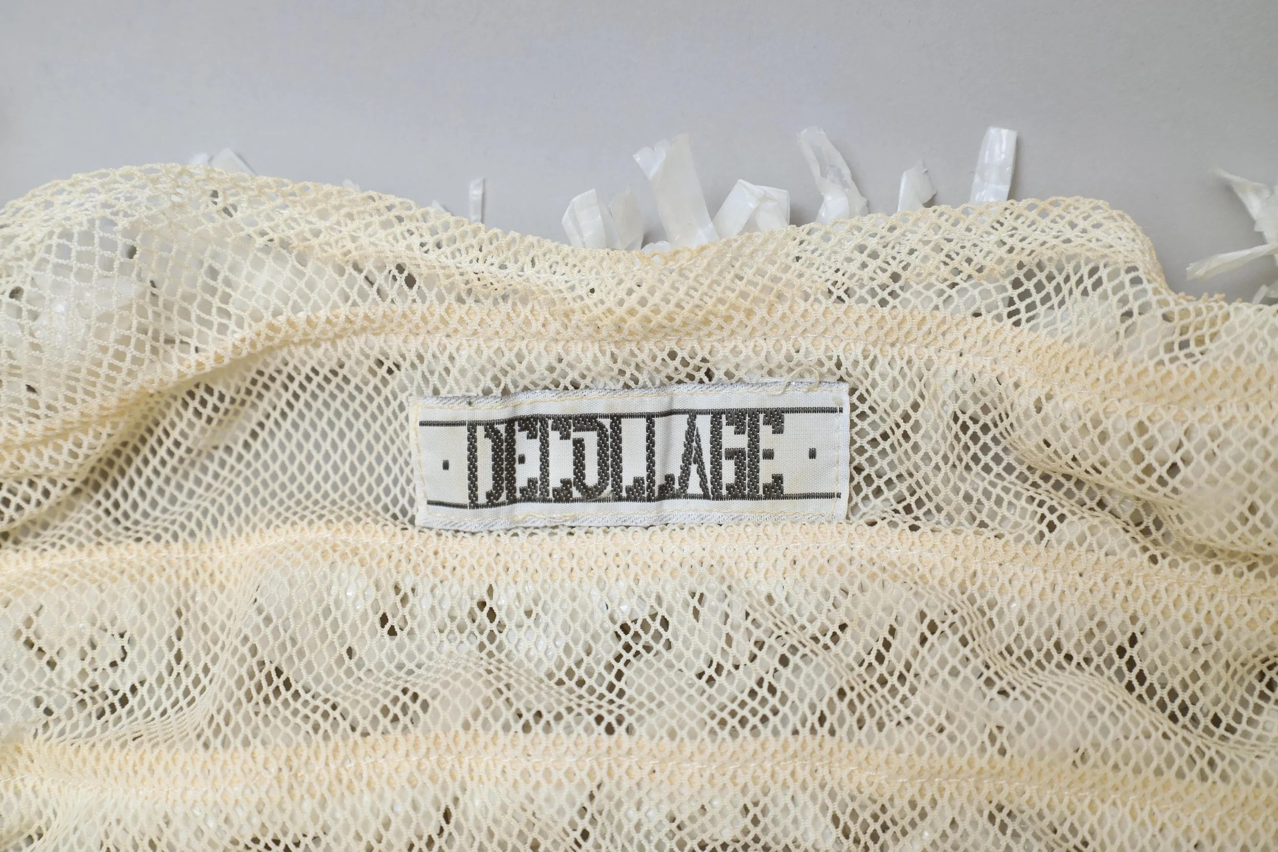 late 1980s / early 1990s Decollage label tag