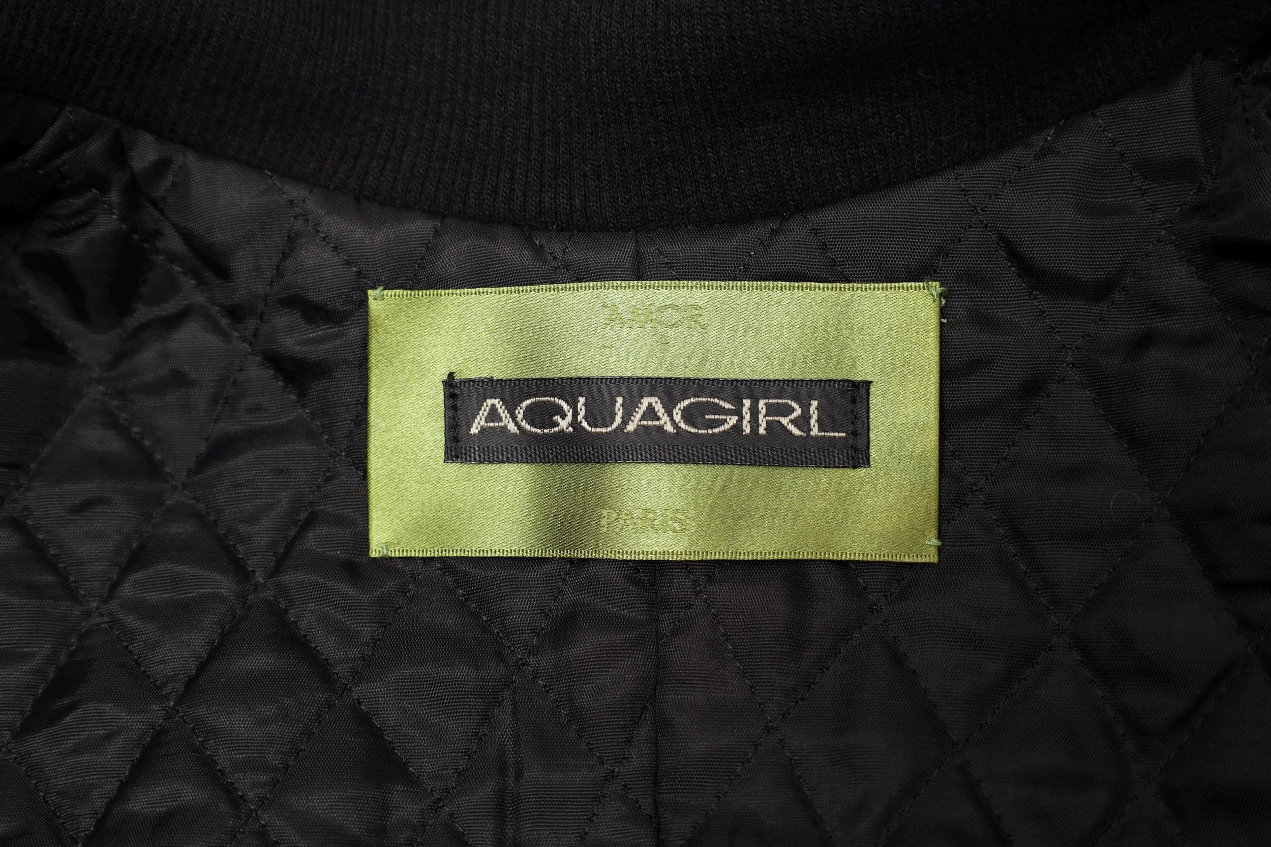 1990s Aquagirl by Fayçal Amor label tag