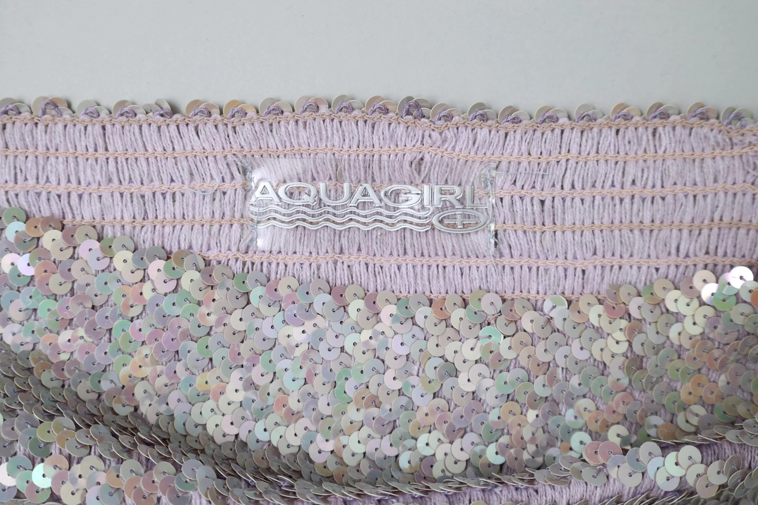 1990s Aquagirl by Fayçal Amor label tag
