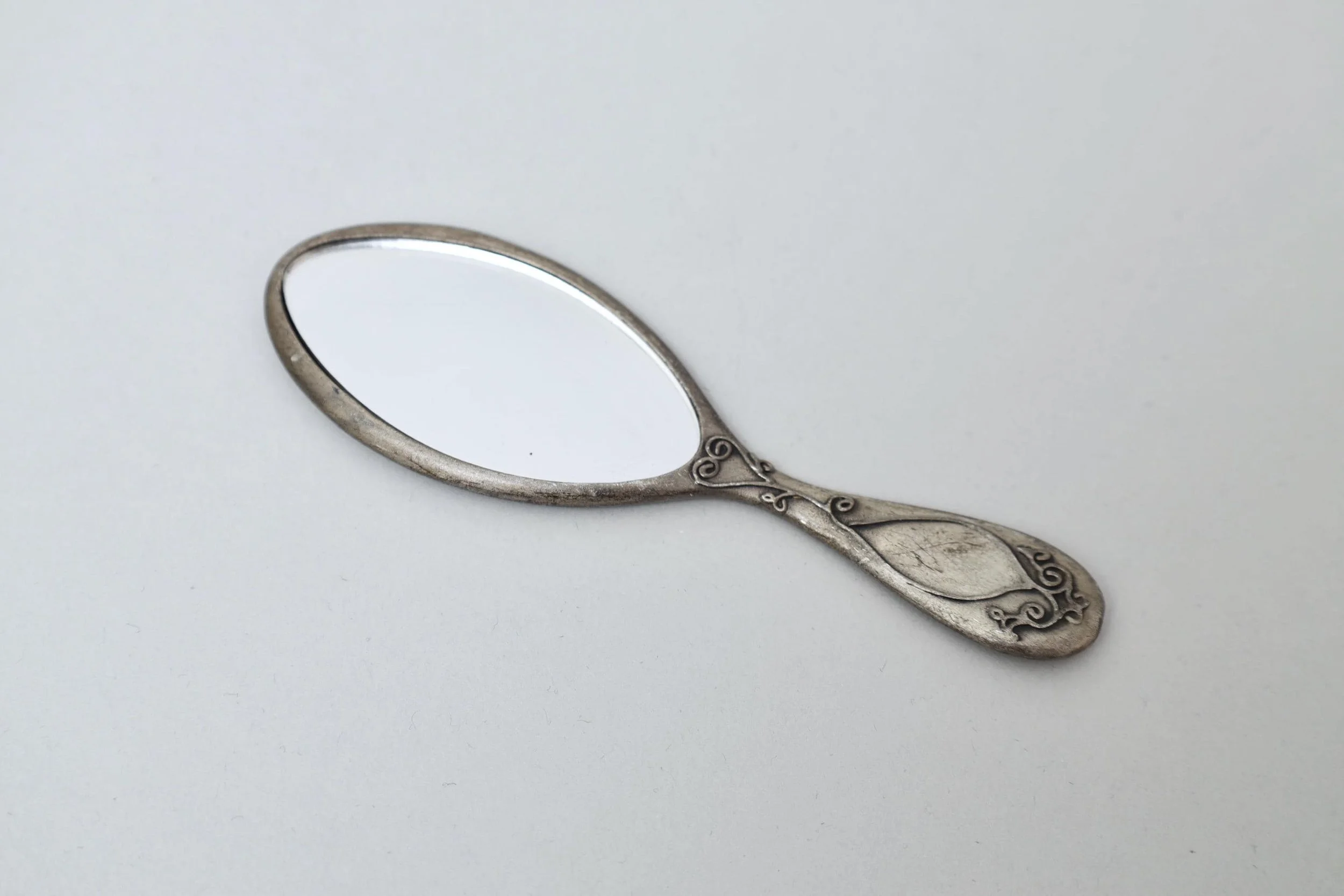 1990s Chantal Thomass decorative mini pewter hand mirror